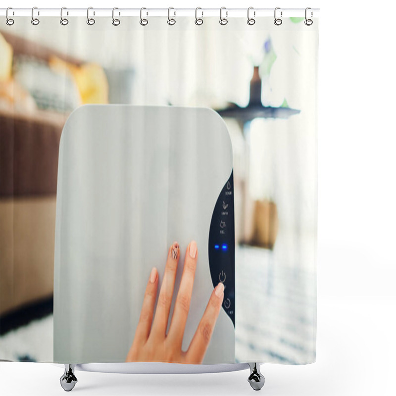 Personality  Woman Turns Dehumidifier On Using Touch Panel At Home. Modern Airdryer Device For Cleaning Air Shower Curtains