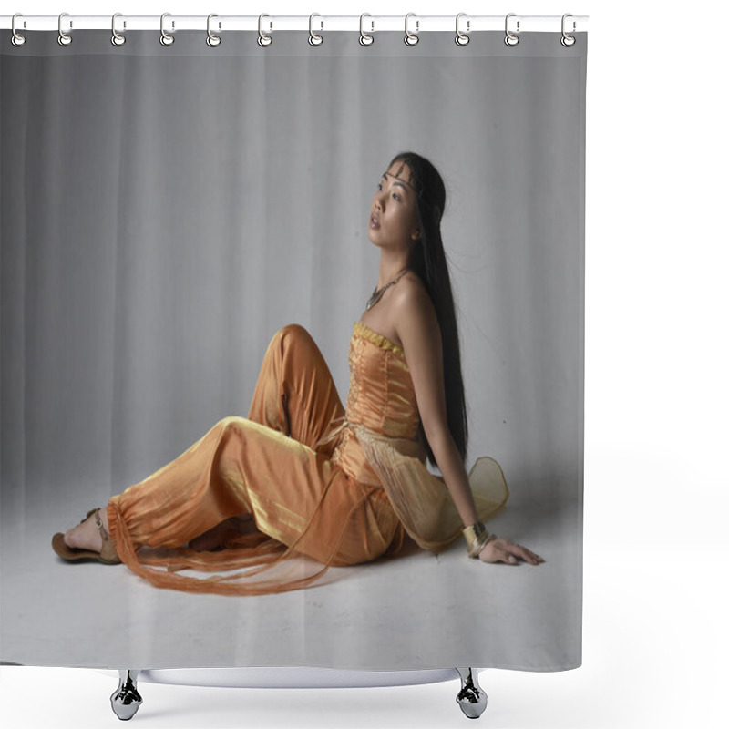 Personality  Full Length Portrait Of Pretty Young Asian Woman Wearing Golden Arabian Robes Like A Genie, Seated Pose, Isolated On Studio Background. Shower Curtains