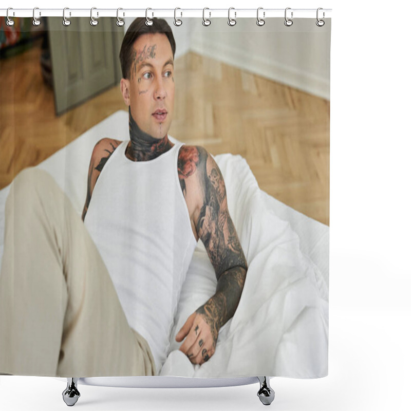 Personality  A Handsome Young Man Lounges On A Bed, Displaying Intricate Tattoos And A Casual Style. Shower Curtains