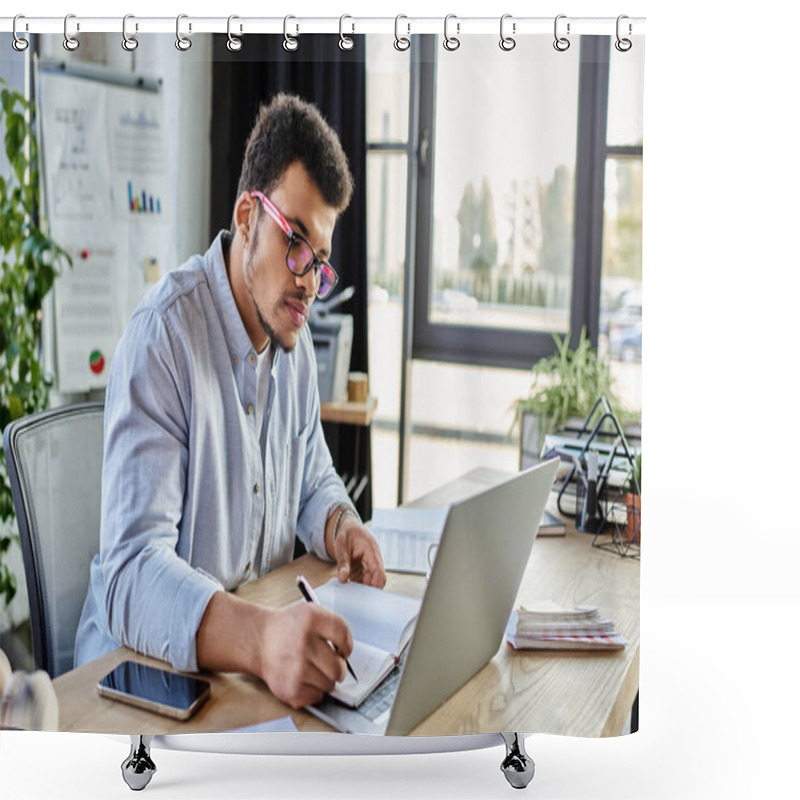 Personality  A Focused Man Writes Notes While Using A Laptop In A Well Lit Office Space. Shower Curtains