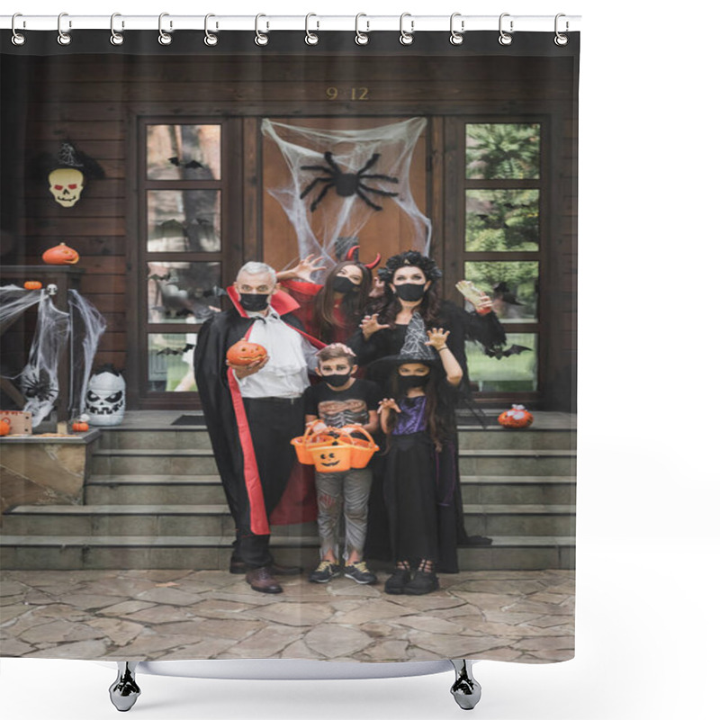 Personality  Creepy Family In Halloween Costumes And Black Medical Masks Showing Scary Gestures Near Porch With Decoration Shower Curtains