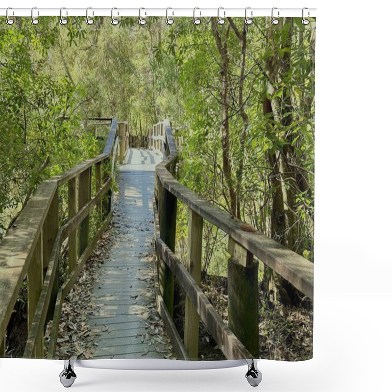 Personality  A Peaceful Wooden Boardwalk Surrounded By Lush Greenery And Dappled Sunlight, Creates A Tranquil Nature Escape. Shower Curtains