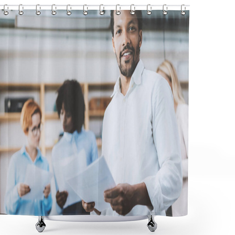 Personality  Dark Skinned Entrepreneur Holding Papers In Hands And Smiling At The Camera.Teamwork Concept In Modern Office. Horizontal,blurred Background. Shower Curtains