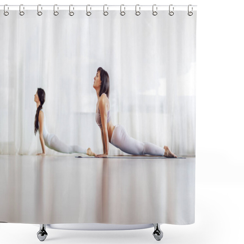 Personality  Two Focused Fit Attractive Caucasian Girls Doing Yoga In Yoga Studio. They Are In Upward-Facing Dog Position. Selective Focus On The Girl In Foreground. Shower Curtains