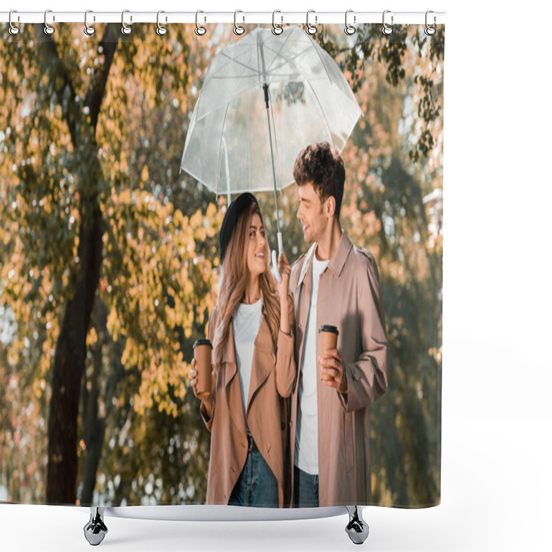 Personality  Couple In Trench Coats Standing Under Umbrella And Holding Paper Cups With Coffee To Go Shower Curtains