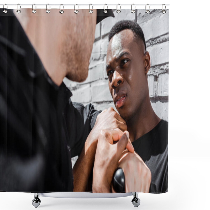 Personality  Police Officer Holding Police Baton Near African American Man On Street, Racism Concept  Shower Curtains