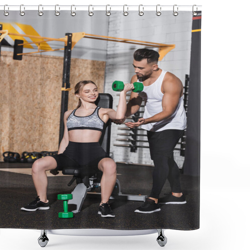 Personality  Smiling Young Woman Exercising With Dumbbell Near Trainer In Sports Center  Shower Curtains