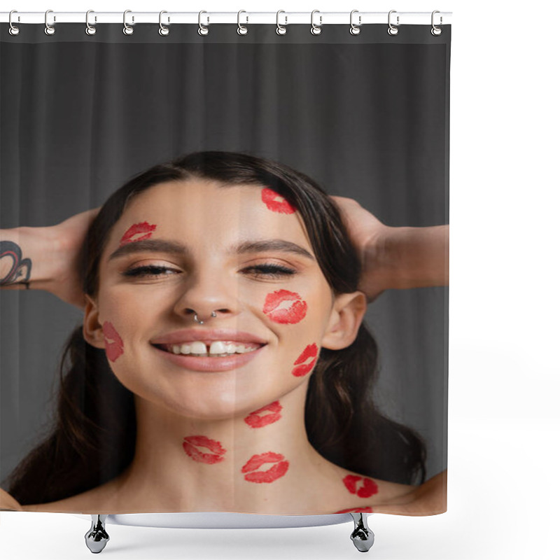 Personality  Portrait Of Cheerful Tattooed Woman With Red Kisses On Face Touching Hair And Smiling At Camera Isolated On Grey Shower Curtains