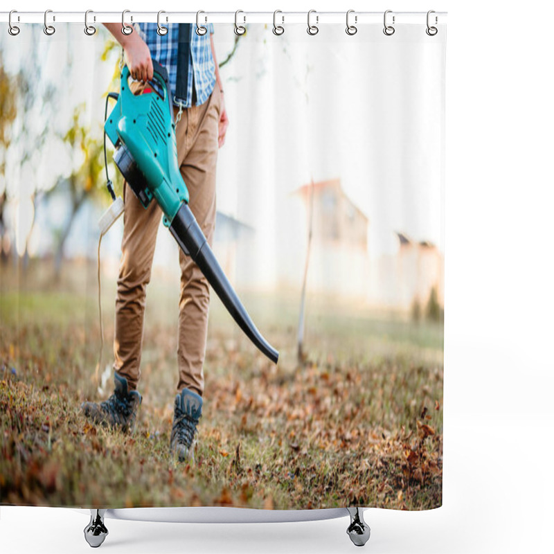 Personality  Gardener Clearing Up Leaves Using An Electric Leaf Blower Tool. Gardening Details Shower Curtains