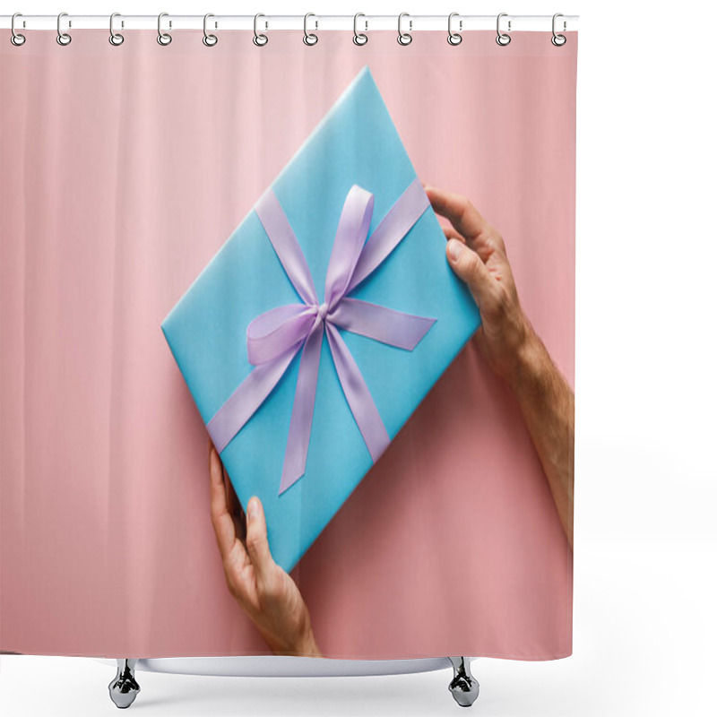 Personality  Cropped View Of Man Holding Blue Gift Box With Violet Satin Ribbon On Pink Background Shower Curtains