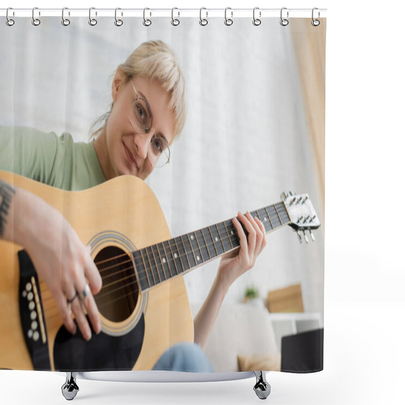 Personality  Cheerful Young Woman In Glasses With Bangs And Tattoo On Hand Playing Acoustic Guitar And Looking At Camera While Sitting In Modern Living Room, Learning Music, Music Enthusiast Shower Curtains