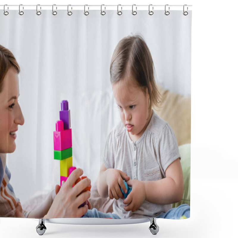 Personality  Focused Child With Down Syndrome Looking At Building Blocks Near Smiling Mom In Bedroom  Shower Curtains