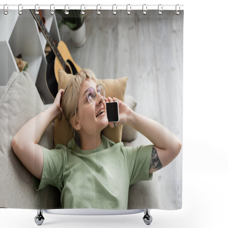 Personality  Overhead View Of Happy Young Woman With Blonde And Short Hair, Bangs And Eyeglasses Talking On Smartphone While Resting On Comfortable Couch Near Guitar In Modern Living Room  Shower Curtains