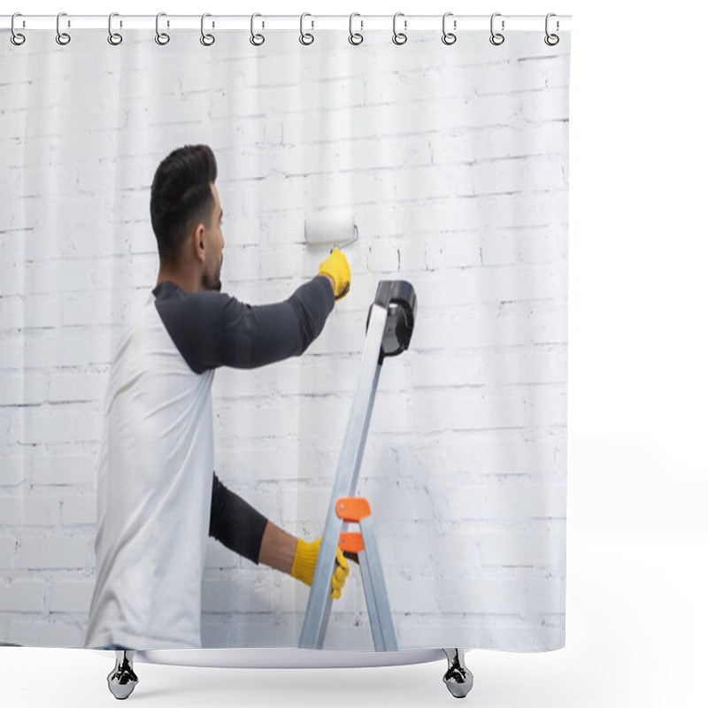 Personality  Young Muslim Man Painting Wall With Roller While Standing On Ladder In Living Room  Shower Curtains