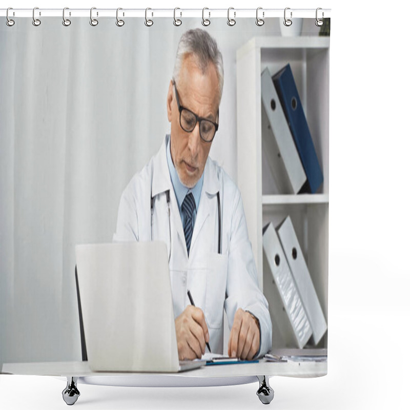 Personality  Serious Doctor Writing Diagnosis On Clipboard Near Laptop At Workplace Shower Curtains