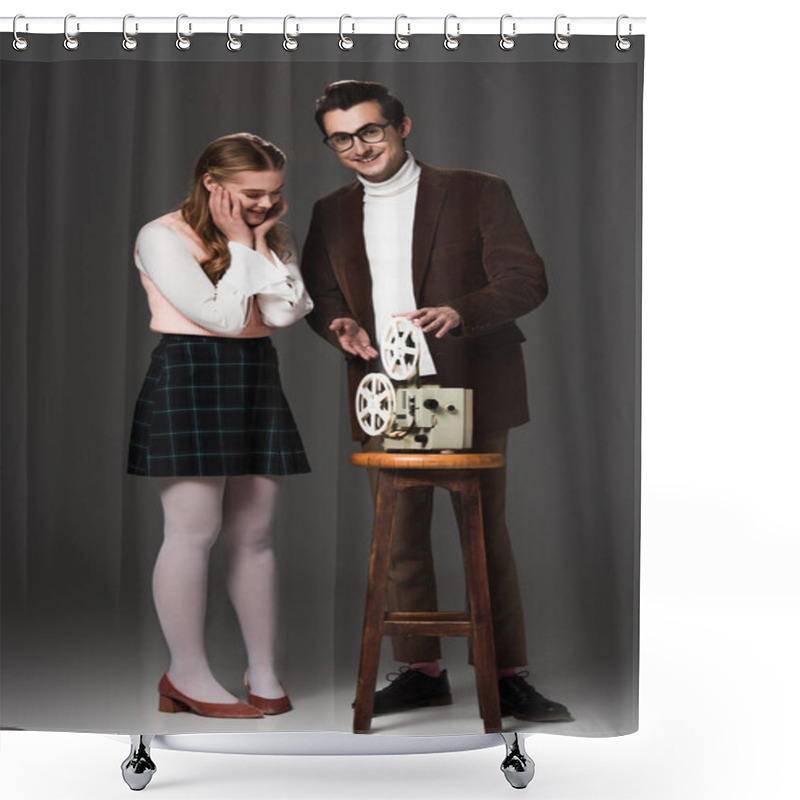 Personality  Smiling Man Pointing At Film Projector Near Amazed Woman On Grey Background Shower Curtains