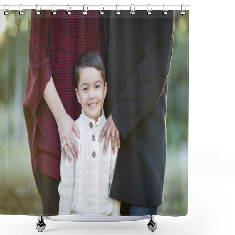 Personality  Young Mixed Race Boy Portrait Outdoors With Parents Behind Shower Curtains