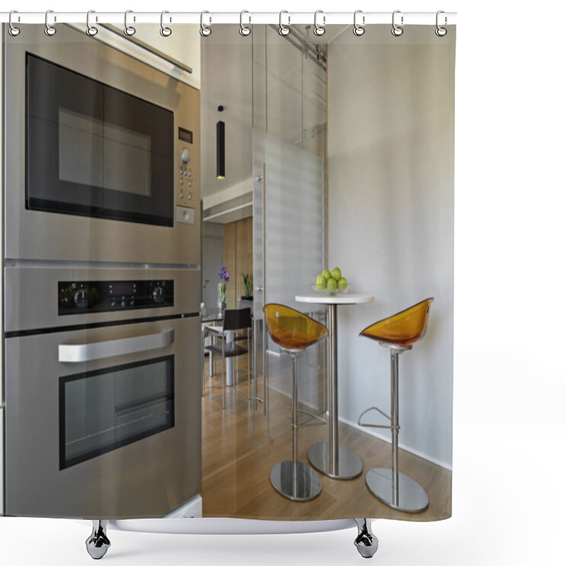 Personality  Interiors Shots Of A Modern Kitchen In Foreground The Built-in Steel Hovens And The Little Round Table With Two Stools Overlooking On The Living Room Shower Curtains