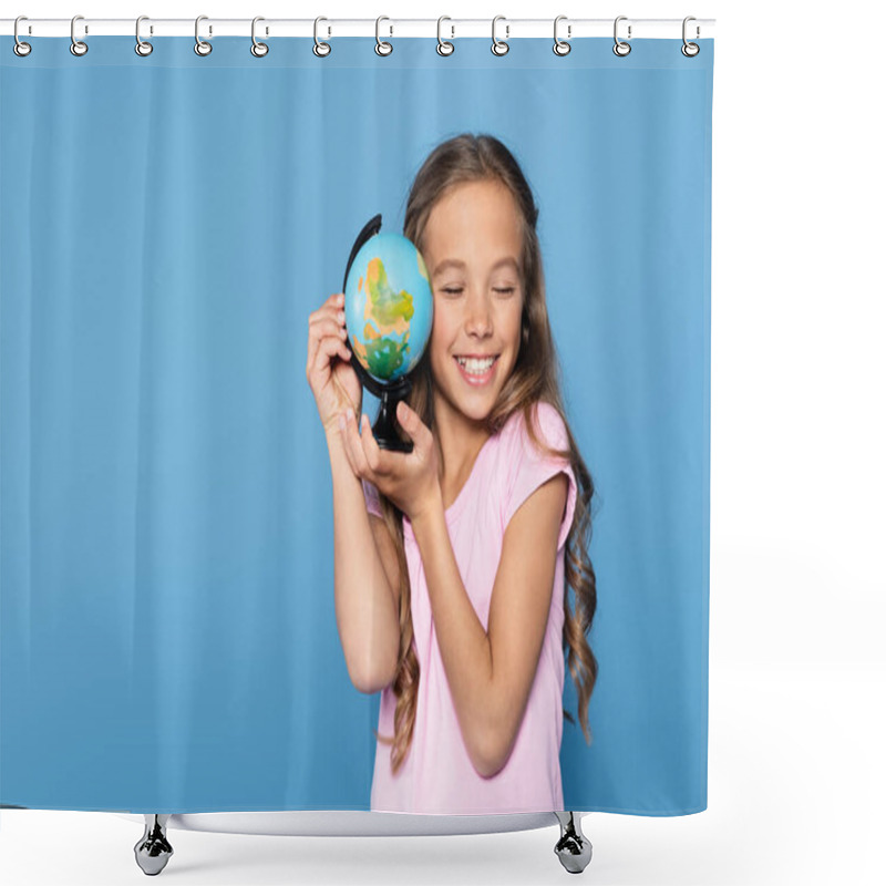 Personality  Girl With Closed Eyes Smiling While Holding Globe Isolated On Blue  Shower Curtains