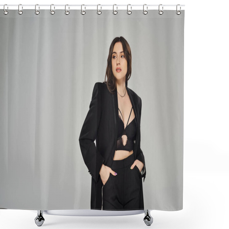 Personality  A Beautiful Plus Size Woman In A Black Suit Strikes A Confident Pose Against A Gray Backdrop. Shower Curtains