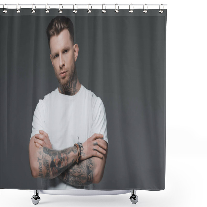 Personality  Portrait Of Handsome Young Tattooed Man In White T-shirt Standing With Crossed Arms And Looking At Camera Isolated On Grey Shower Curtains