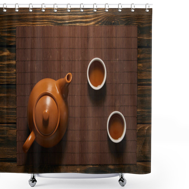 Personality  Top View Of Brown Ceramic Teapot And Cups Of Tea On Bamboo Mat Shower Curtains