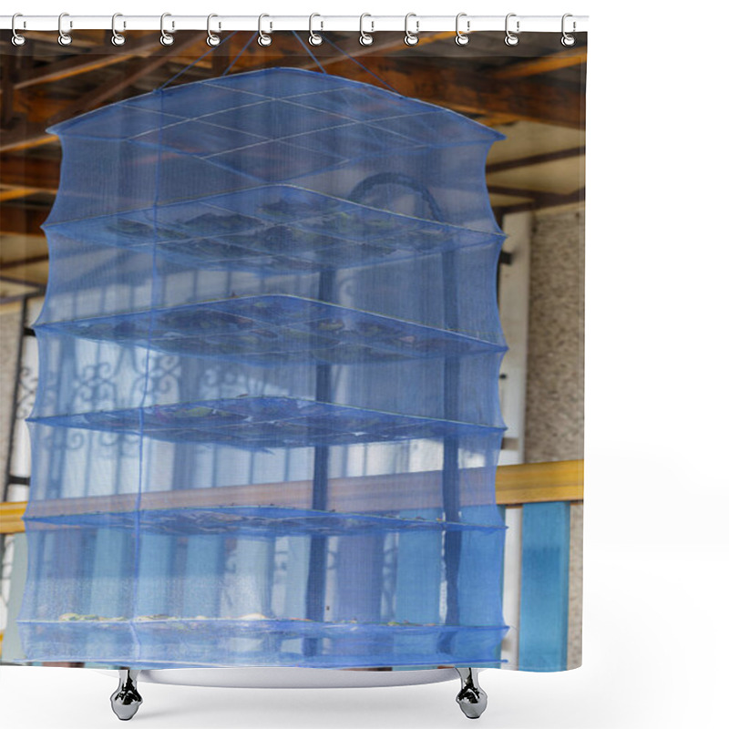 Personality  Blue Mesh Fruit Dryer Hanging Outdoors On A Sunny Day. Concept Of Natural Food Preservation, Organic Drying Process, And Outdoor Drying Equipment Shower Curtains