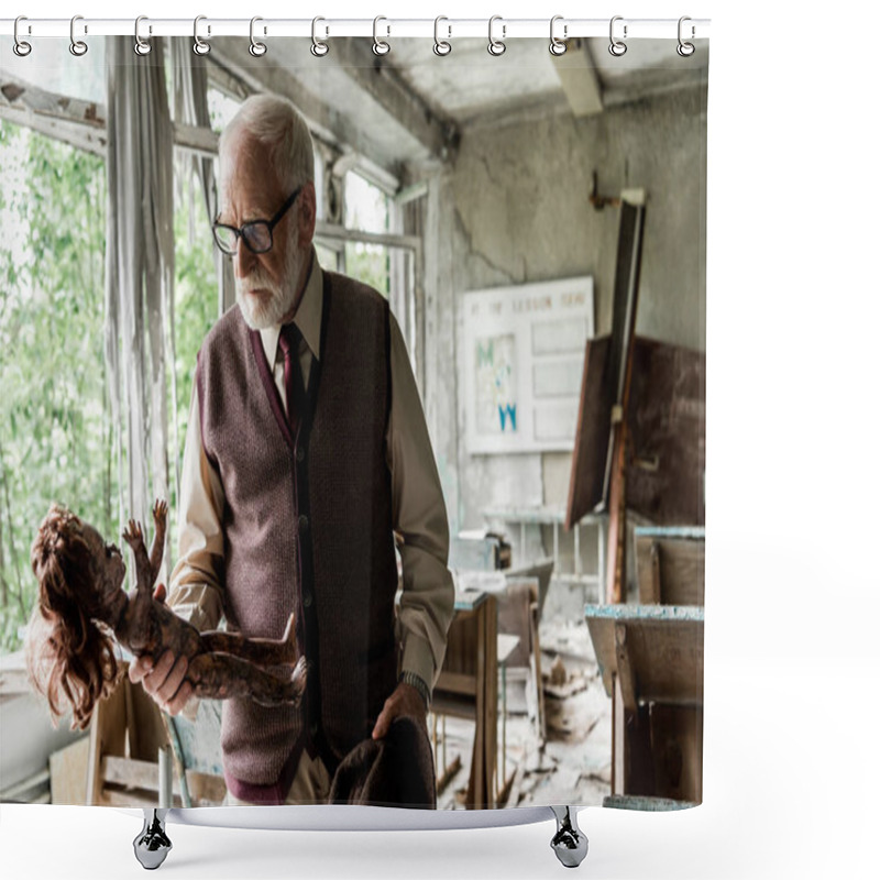 Personality  Bearded Senior Man Holding Hat While Looking At Dirty Baby Doll In Classroom  Shower Curtains