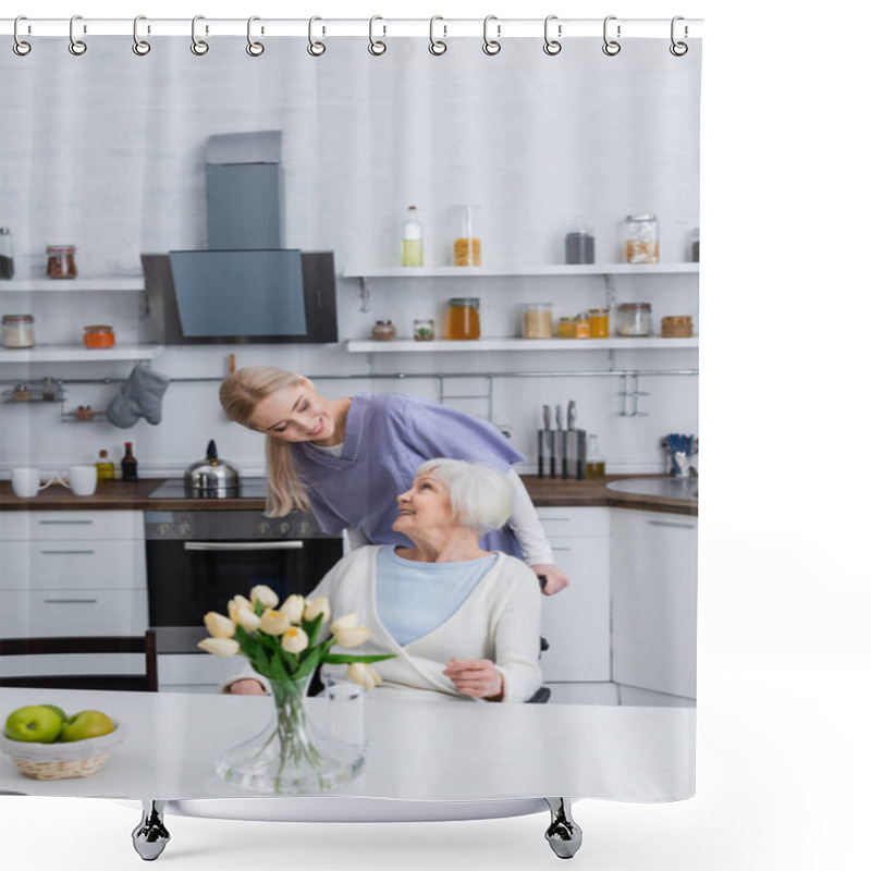 Personality  Young Social Worker Looking At Happy Elderly Woman Sitting In Kitchen Shower Curtains