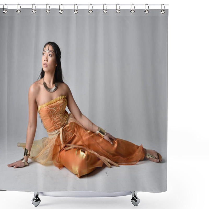 Personality  Full Length Portrait Of Pretty Young Asian Woman Wearing Golden Arabian Robes Like A Genie, Seated Pose, Isolated On Studio Background. Shower Curtains