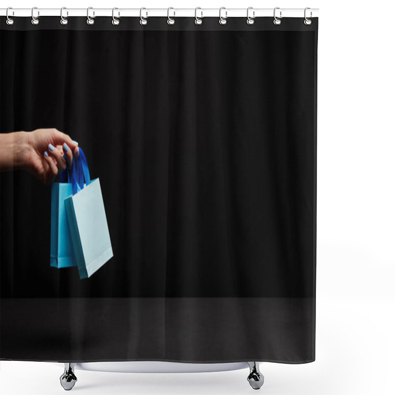 Personality  Partial View Of Woman Holding Blue Paper Shopping Bags On Black Background Shower Curtains