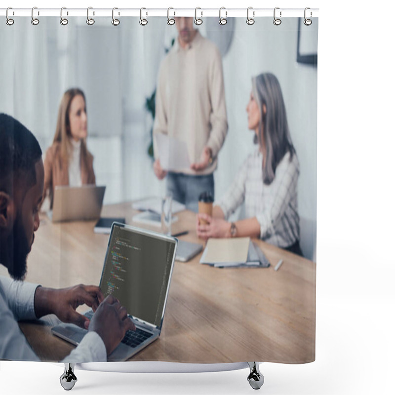 Personality  KYIV, UKRAINE - DECEMBER 6, 2019: Selective Focus Of African American Man Using Laptop With Html Code Website And His Colleagues Talking On Background  Shower Curtains