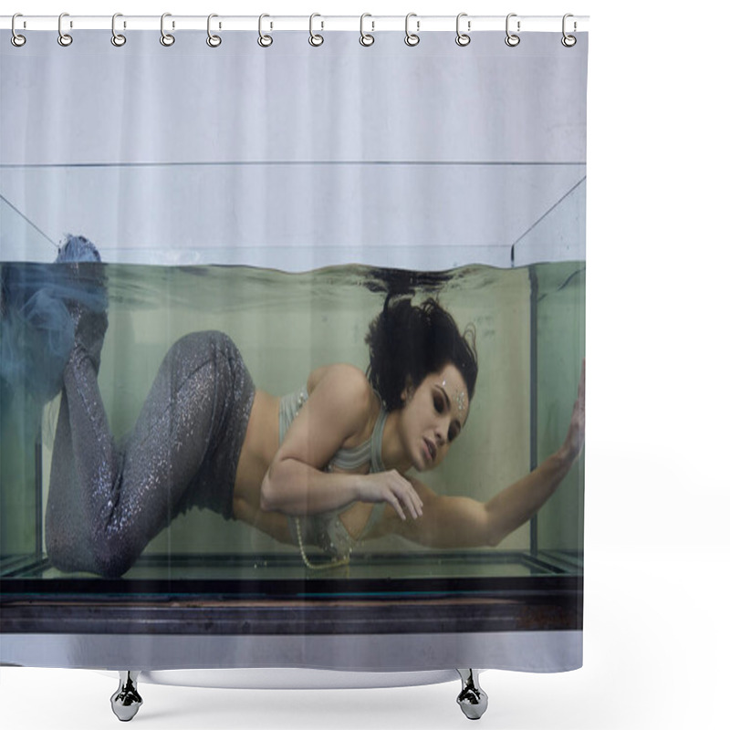 Personality  A Young Woman In A Mermaid Costume Swims Underwater In A Large Glass Tank, Her Expression Wistful. Shower Curtains