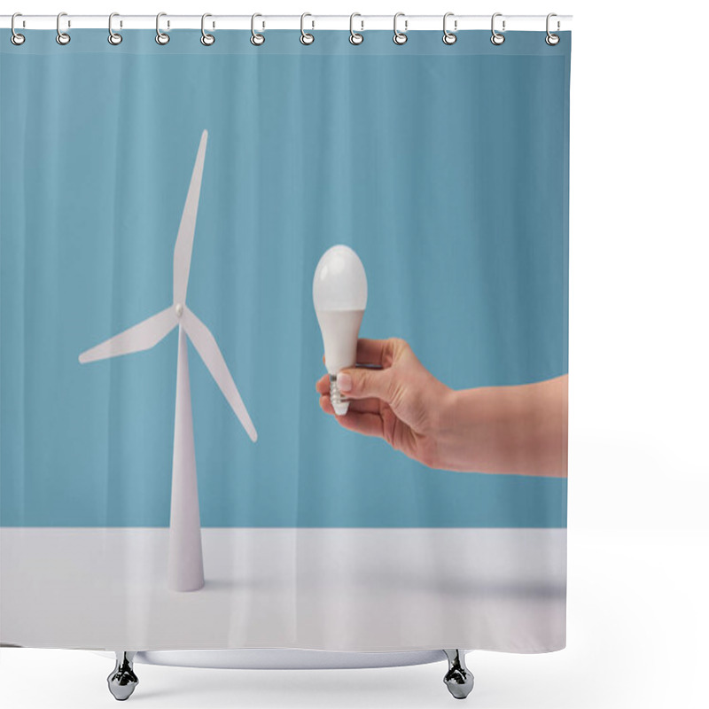 Personality  Cropped View Of Woman Holding Light Bulb Over White Table With Windmill Model On Blue Background Shower Curtains