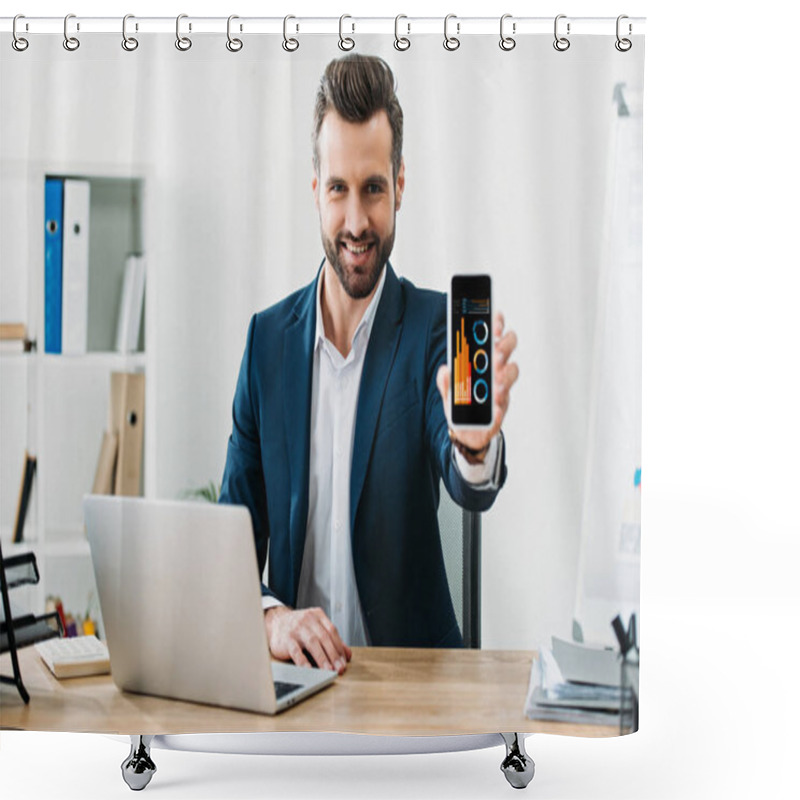 Personality  Businessman Sitting At Table With Laptop And Showing Smartphone With Charts And Graphs App On Screen In Office Shower Curtains