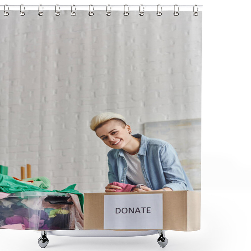 Personality  Young And Joyful Woman With Trendy Hairstyle Holding Pre-loved Clothes And Looking At Camera Near Plastic Container And Donation Box At Home, Sustainable Living And Social Responsibility Concept Shower Curtains