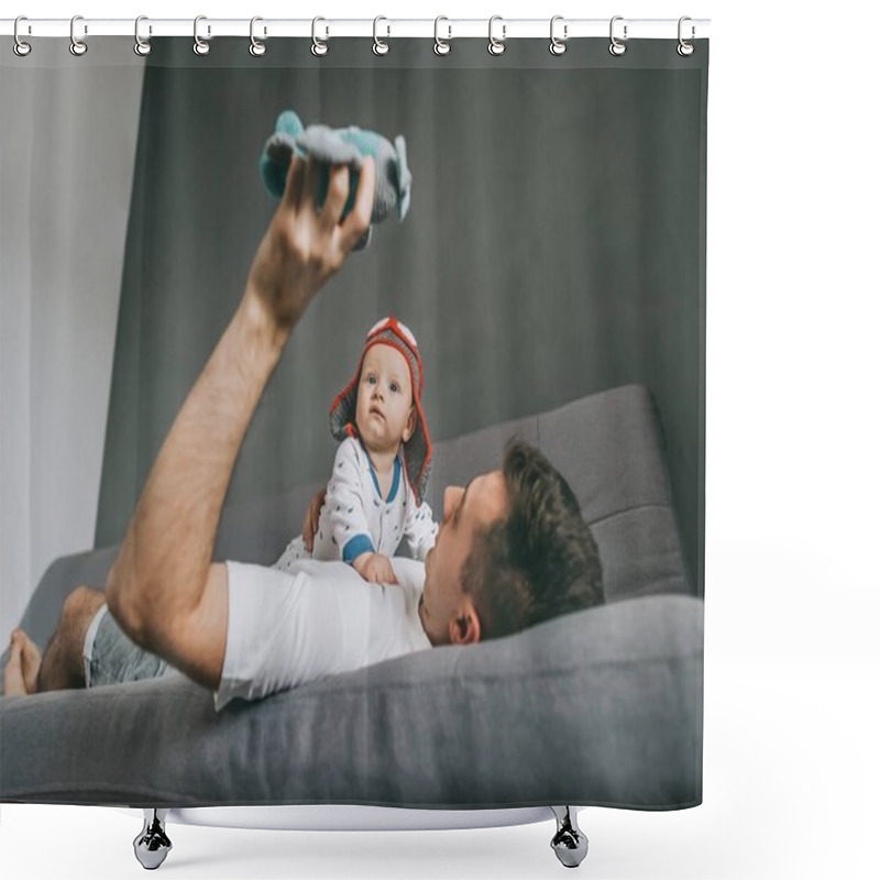 Personality  Father Holding Toy Plane While Lying On Sofa And Playing With Adorable Infant Child Wearing Knitted Pilot Hat Shower Curtains