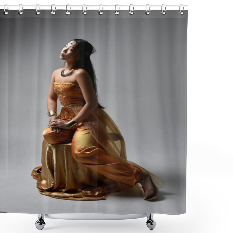 Personality  Full Length Portrait Of Pretty Young Asian Woman Wearing Golden Arabian Robes Like A Genie, Seated Pose, Isolated On Studio Background. Shower Curtains