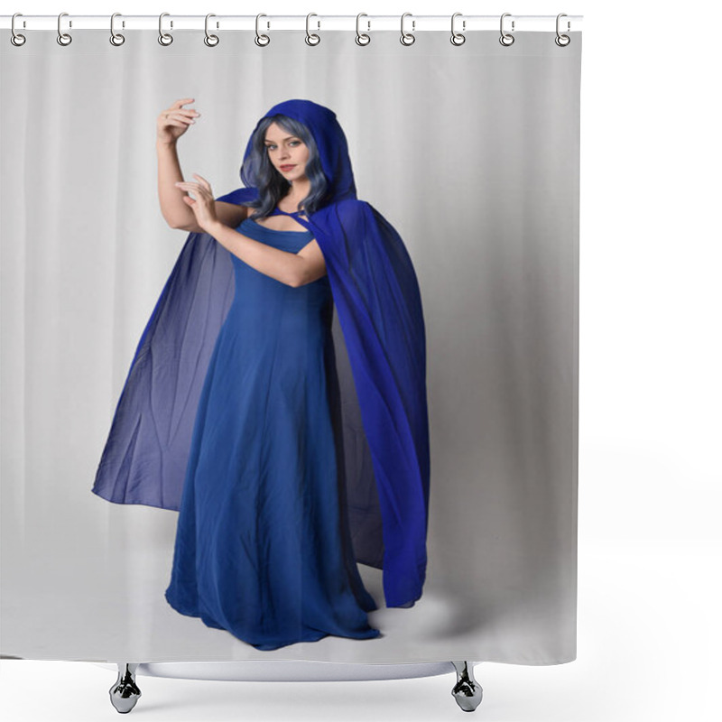 Personality  Full Length Portrait Of Beautiful Female Model Wearing Elegant Fantasy Blue Ball Gown And Flowing Cape With Hood.Standing Pose, With Gestural Arms Reaching Out . Isolated On White Studio Background. Shower Curtains