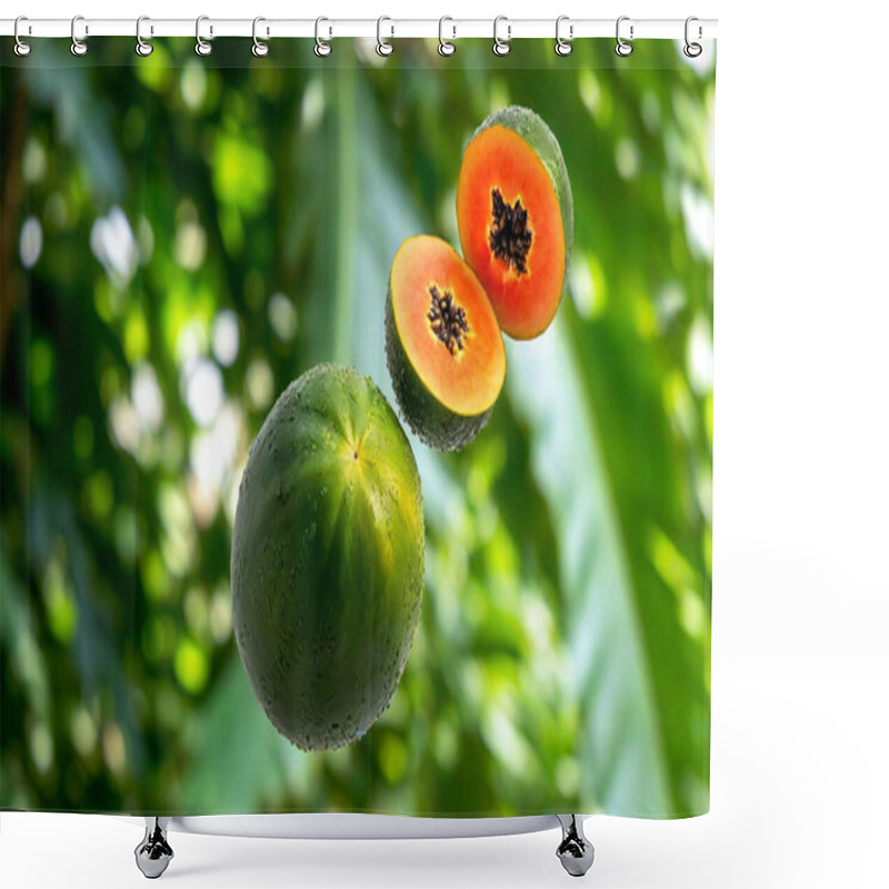 Personality  A Fresh Papaya With Seeds Floating Mid-air Against A Bright Tropical Foliage Background. Shower Curtains