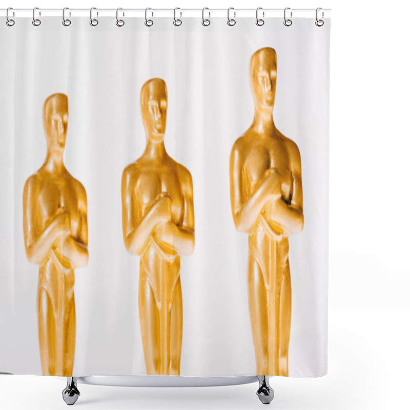 Personality  KYIV, UKRAINE - JANUARY 10, 2019: Golden Oscar Award Figurines Isolated On White Shower Curtains