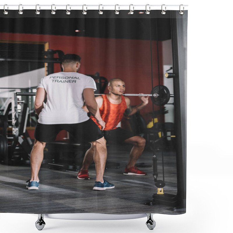 Personality  Back View Of Personal Trainer Supporting Young African American Sportsman Lifting Barbell Shower Curtains