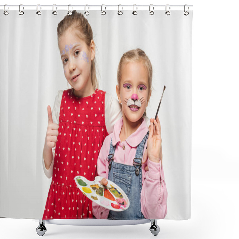 Personality  Adorable Kid With Cat Muzzle Painting Of Face Holding Palette And Paintbrush, While Friend With Floral Mask Showing Thumb Up Isolated On White Shower Curtains