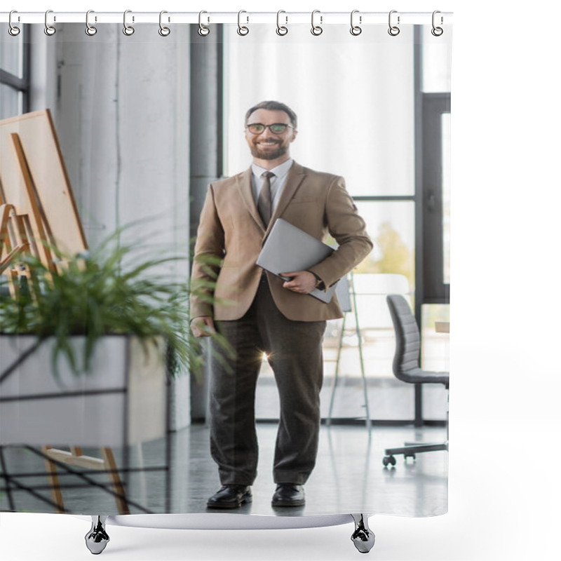 Personality  Full Length On Successful Bearded Businessman In Trendy Blazer, Pants, Tie And Eyeglasses Holding Laptop And Smiling At Camera Near Flip Chart And Blurred Plants In Modern Office Shower Curtains