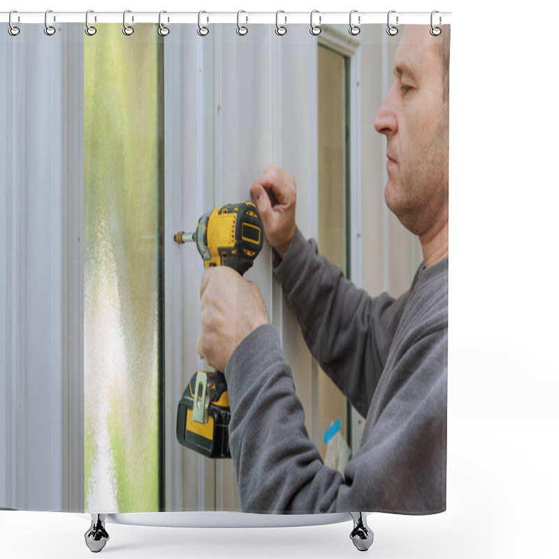 Personality  Man Focuses Intently On Fixing Window Frame, Using Power Drill For Task He Is Engaged In Home Improvement Work. Shower Curtains