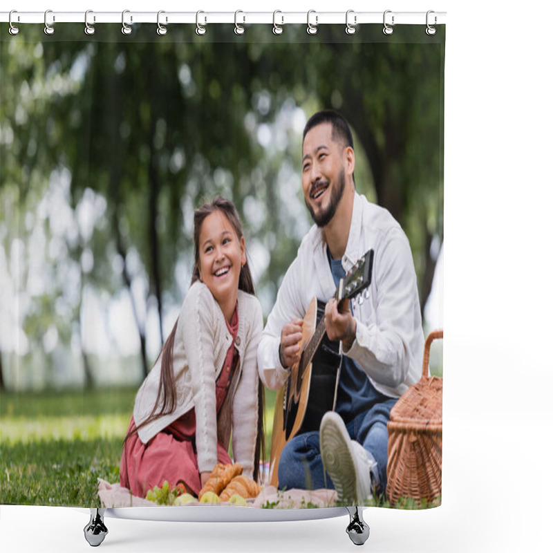 Personality  Smiling Asian Dad Playing Acoustic Guitar Near Daughter And Croissants On Blanket In Park  Shower Curtains