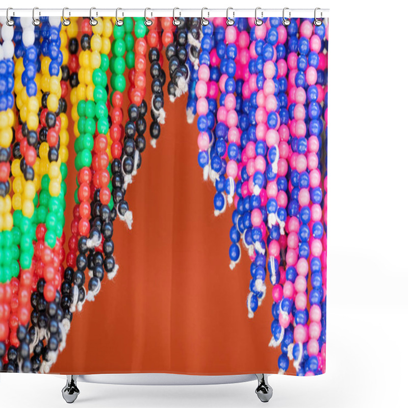 Personality  Detail Of Traditional Beaded Costume For Sale In A Market In South Africa. Strings Of Multicoloured Beads Hang Against An Orange Background. Shower Curtains