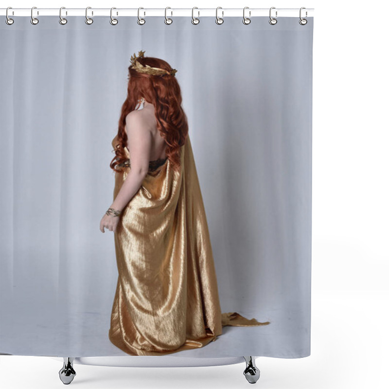 Personality  Full Length Portrait Of Girl With Red Hair Wearing Long Grecian Toga And Golden Wreath. Standing Pose With Back To The Camera,  Isolated Against A Grey Studio Background. Shower Curtains