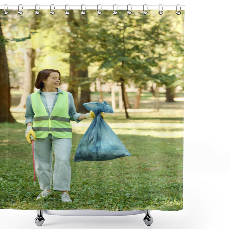 Personality  A Woman Wearing A Green Vest And Holding A Blue Bag, Standing Confidently In A Park, Possibly Ready To Clean Up Litter. Shower Curtains