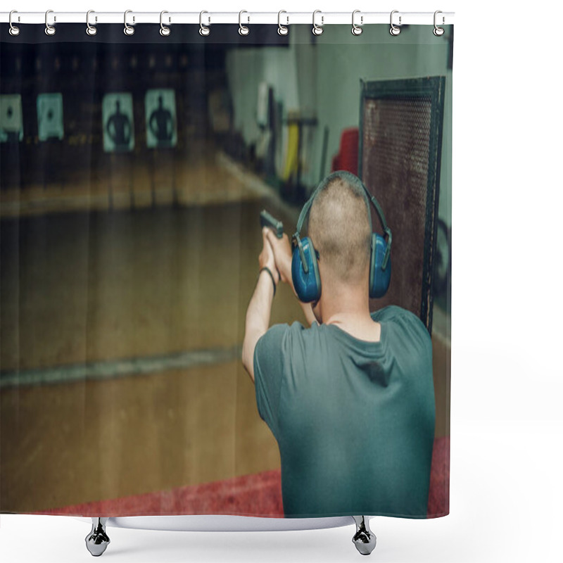 Personality  A Professional Man Wearing Earmuffs And Goggles Is Practicing Shooting A 9mm Pistol Inside A Shooting Range. Shower Curtains